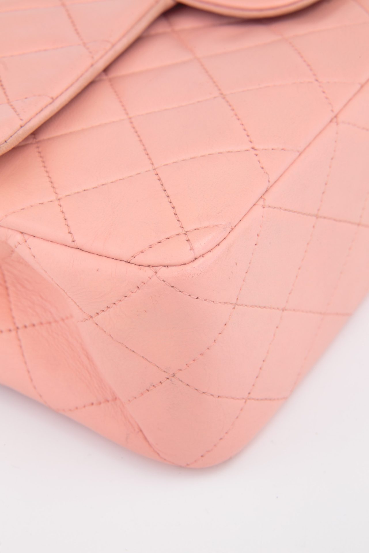 edges of vintage chanel bag in pink