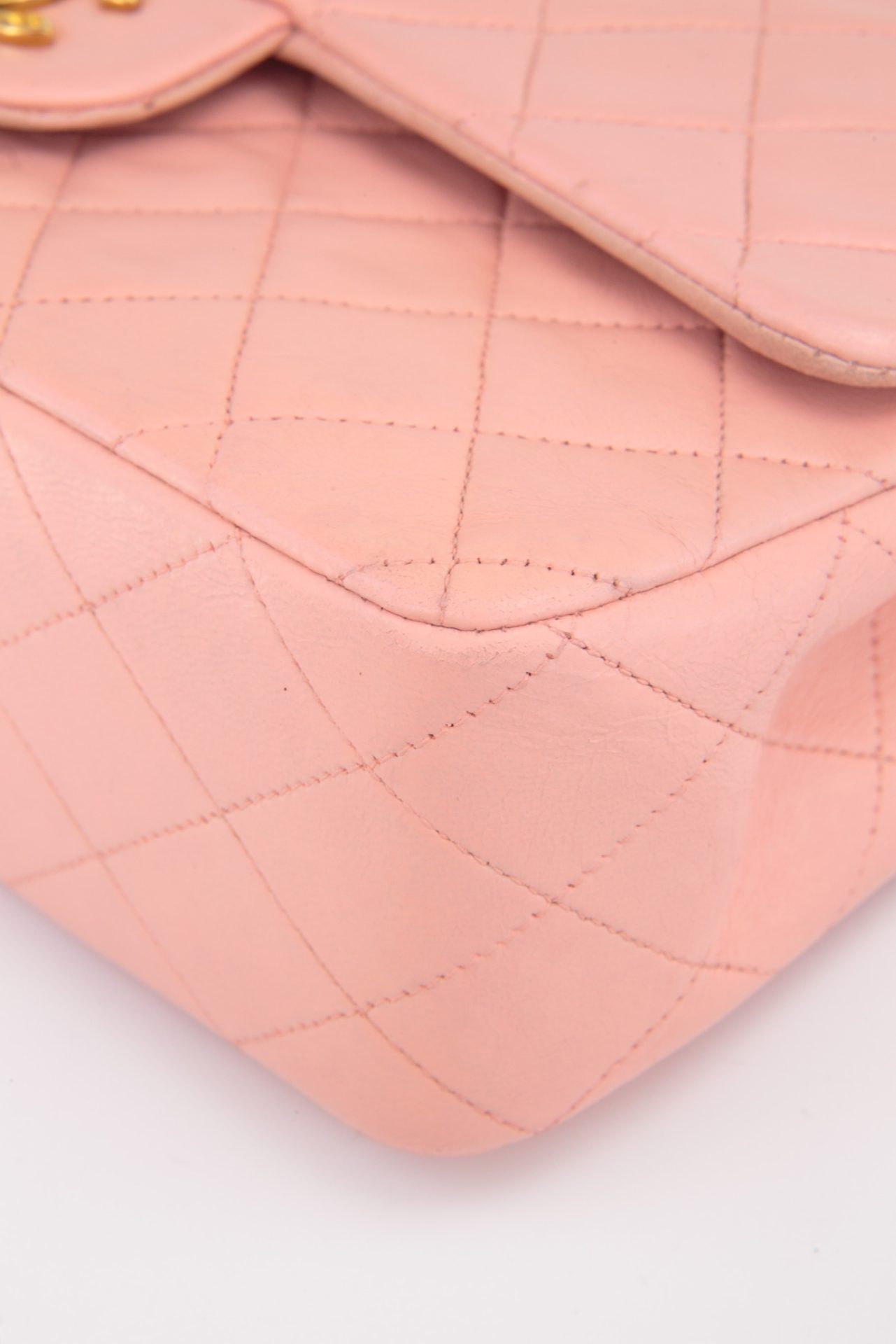 edges of vintage chanel bag in pink